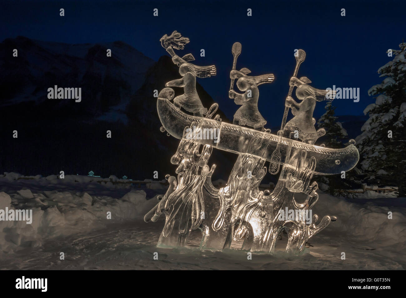 Ice sculpture of indigenous people in a canoe, Lake Louise, Banff National Park, Alberta, Canada Stock Photo