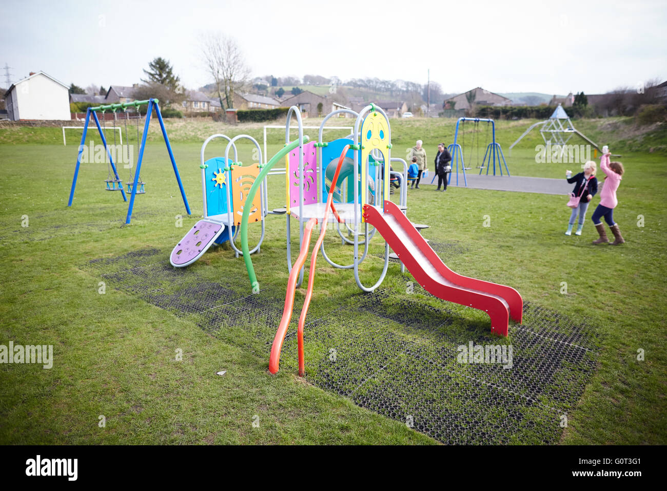 Playing filed ground park children's playground   slides frame climbing modern swings fields playing Young kids children youngst Stock Photo