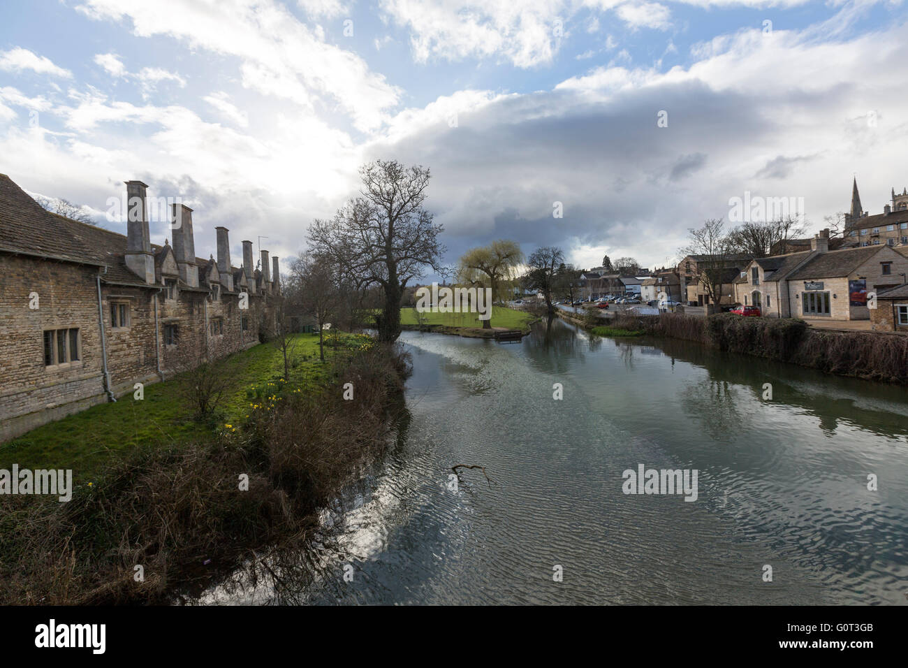 View from St Mary's Bridge of Lord Burghley's Hospital and River Welland, Stamford, Lincolnshire, England, Stock Photo