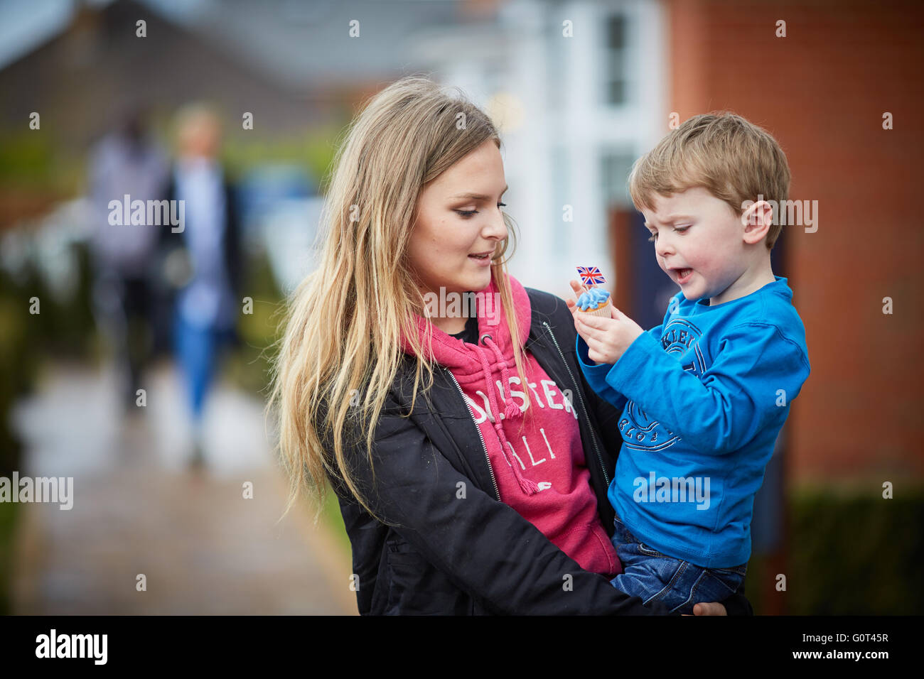 Younger brother older sister   boy girl viewing houses showroom browsing family Architect  property properties building developm Stock Photo