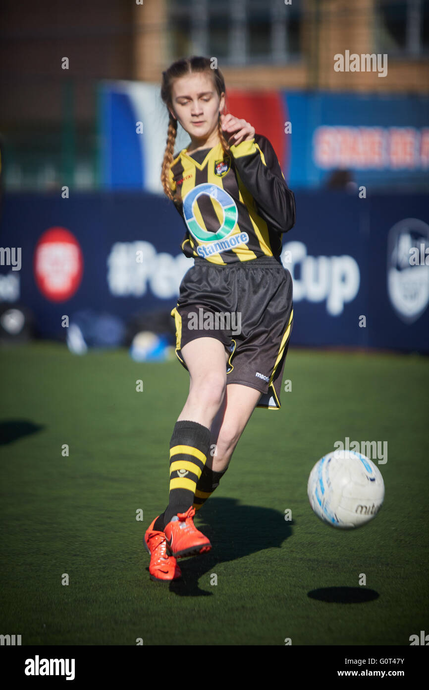 Young teenage girl shooting practice in kit full score goal penalty spot   Young kids children youngsters child toddlers adolesc Stock Photo