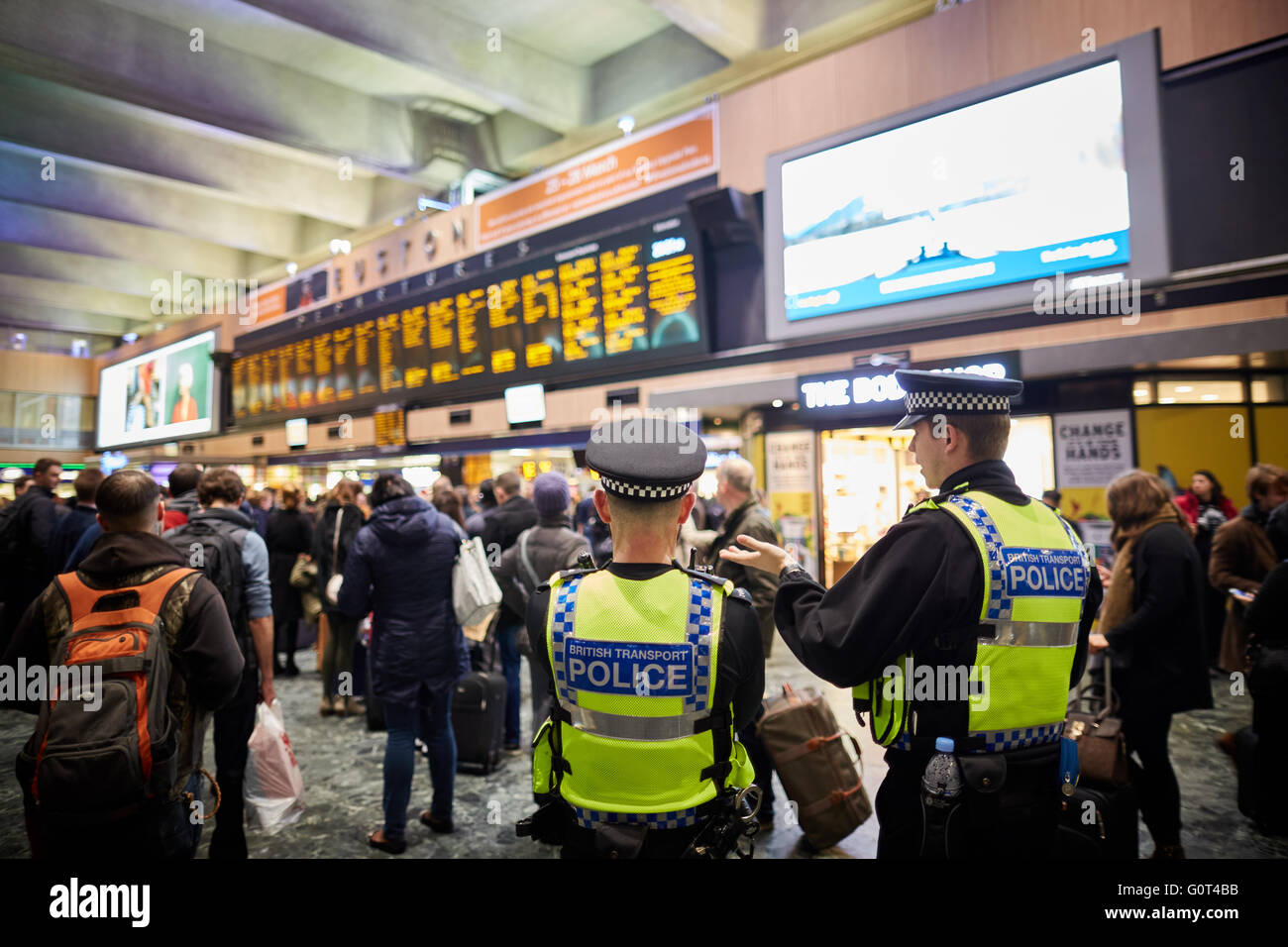 london Euston railway station concourse destination boards waiting area rush crush information