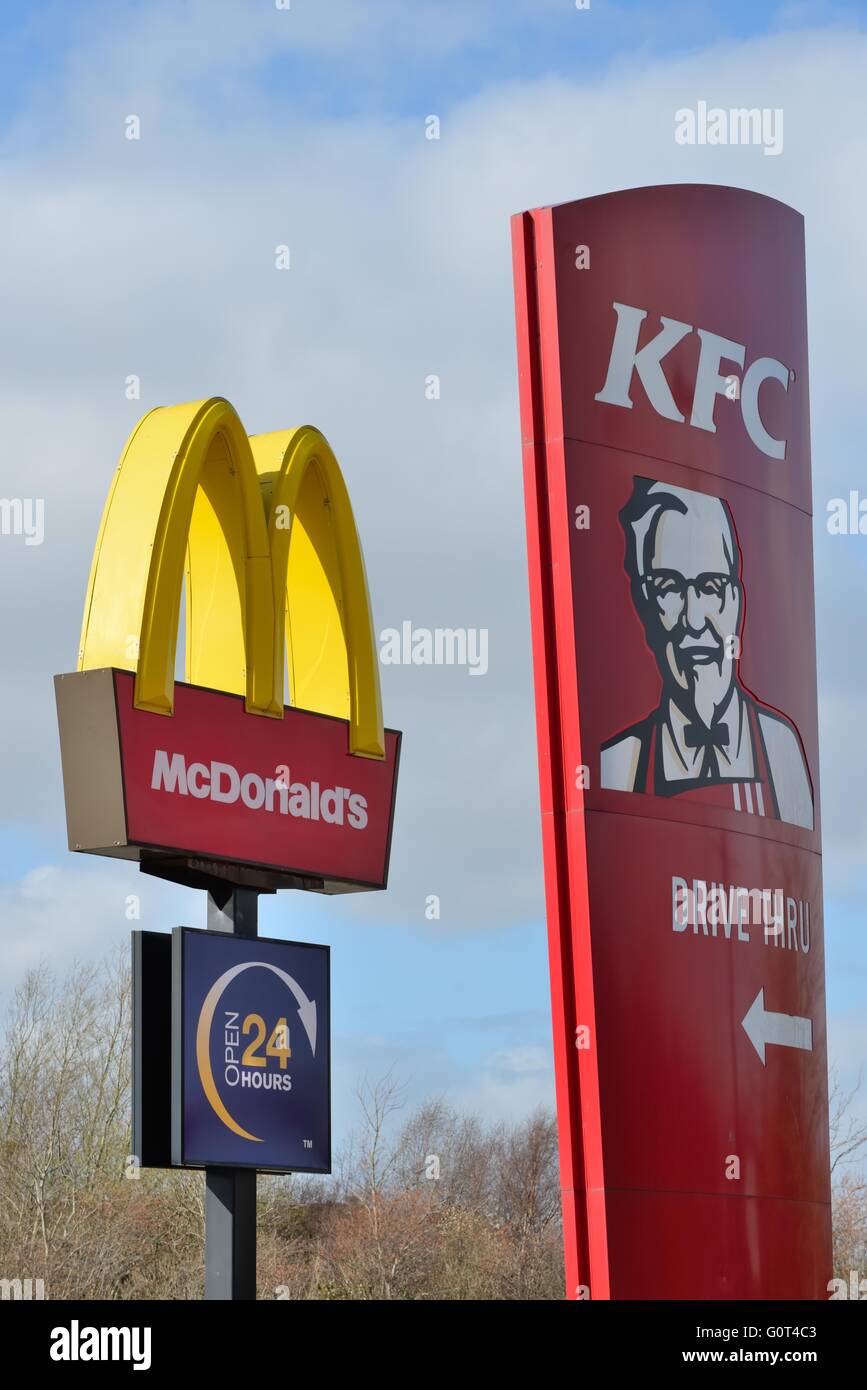 Large American take away fast food company signs side by side in Glasgow, Scotland, UK Stock Photo