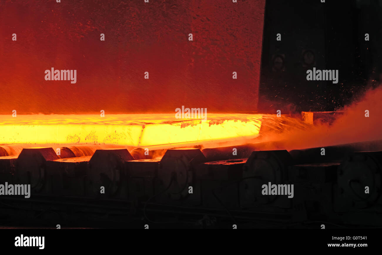 Hot steel on conveyor.production at steel mill Stock Photo