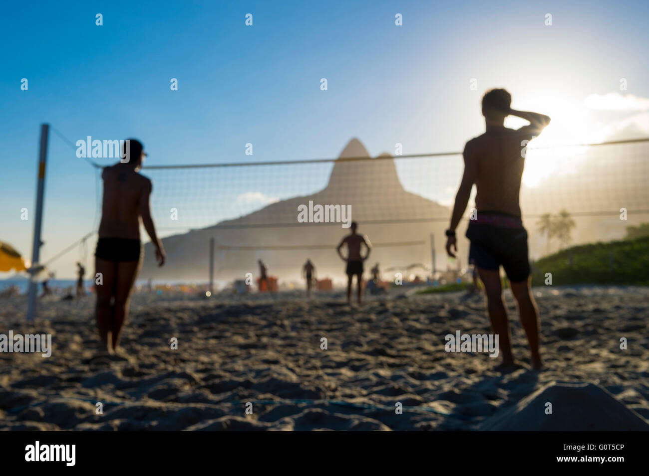 Defocused scene of silhouettes of Brazilians playing futevolei (footvolley) on Ipanema Beach Rio de Janeiro Brazil Stock Photo