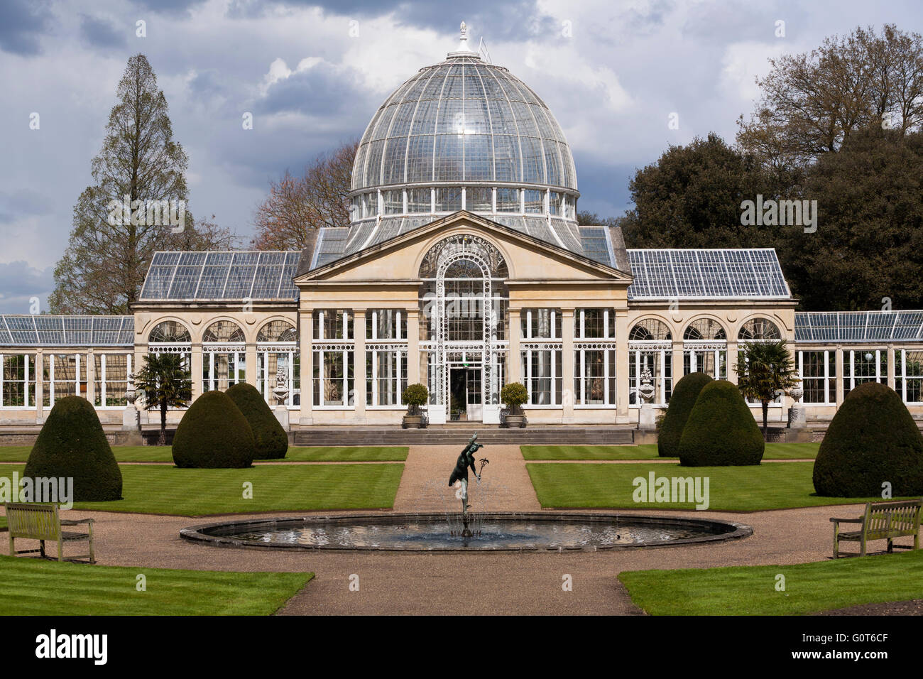 Syon House Great Conservatory with glass dome (Grade I listed building) and statue of winged Mercury and formal garden pond. UK Stock Photo