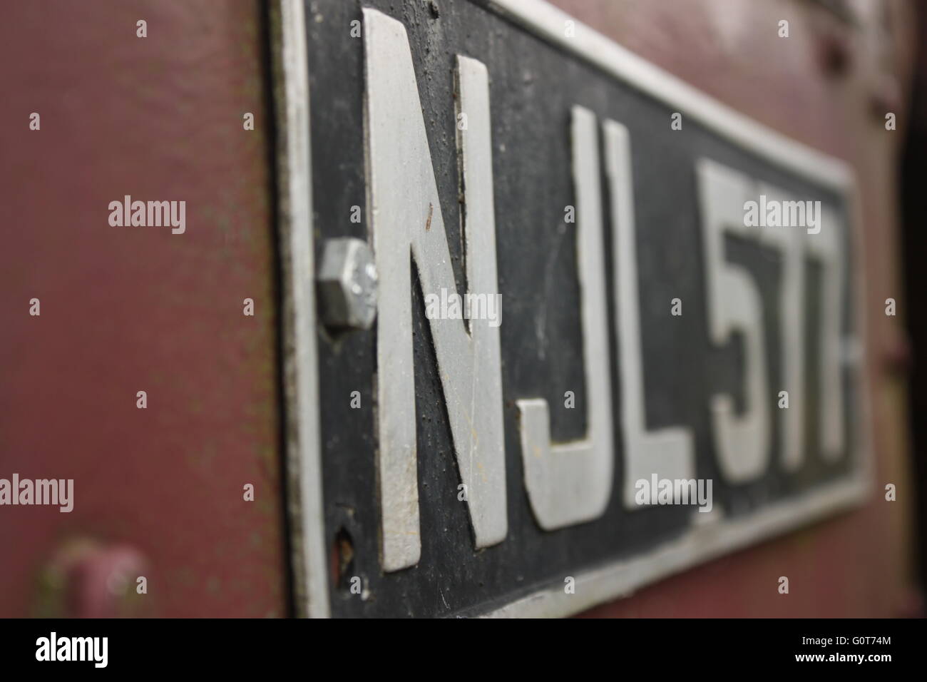 Old Fashioned Number Plate on an Old Engine in Cumbria, United Kingdom