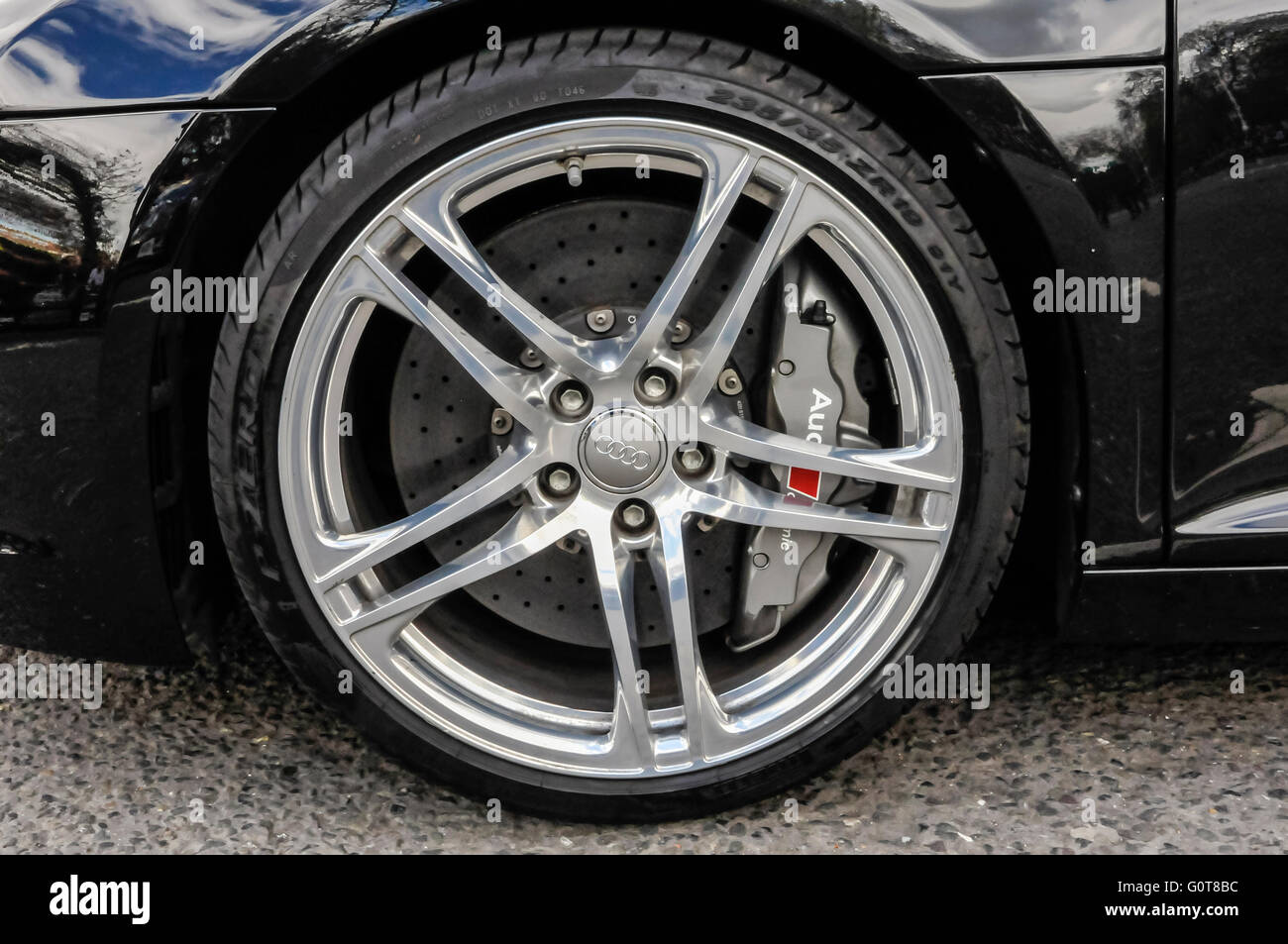 Disc brake caliper on the front wheel of an Audi R8 Quattro Stock Photo