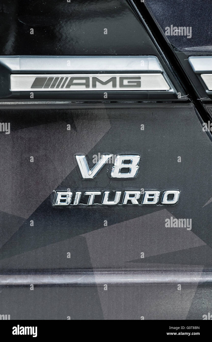 AMG, V8 and Bi Turbo badges on the side of a Mercedes SLS. Stock Photo