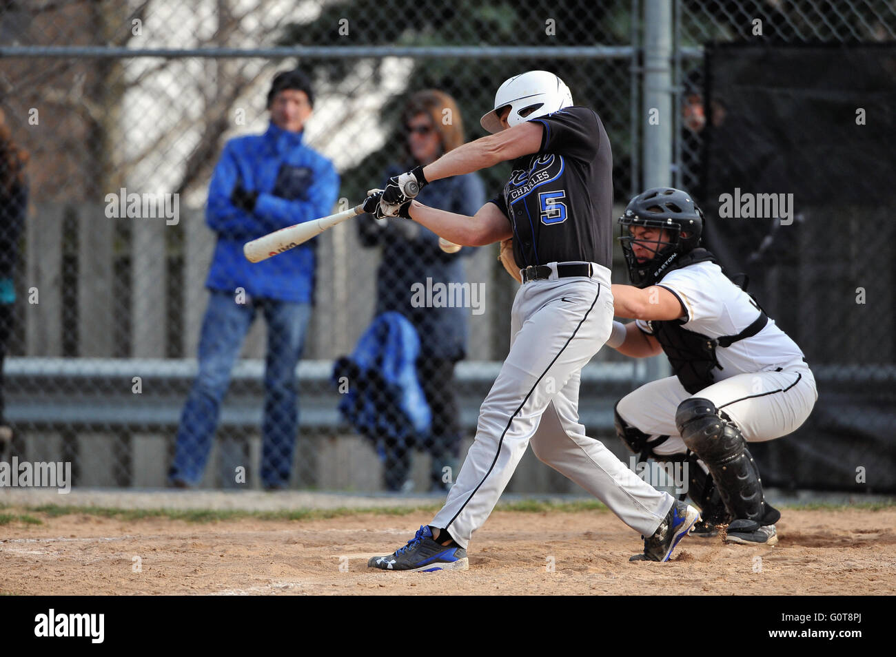 A hitter follows through on his swing following making contact with a