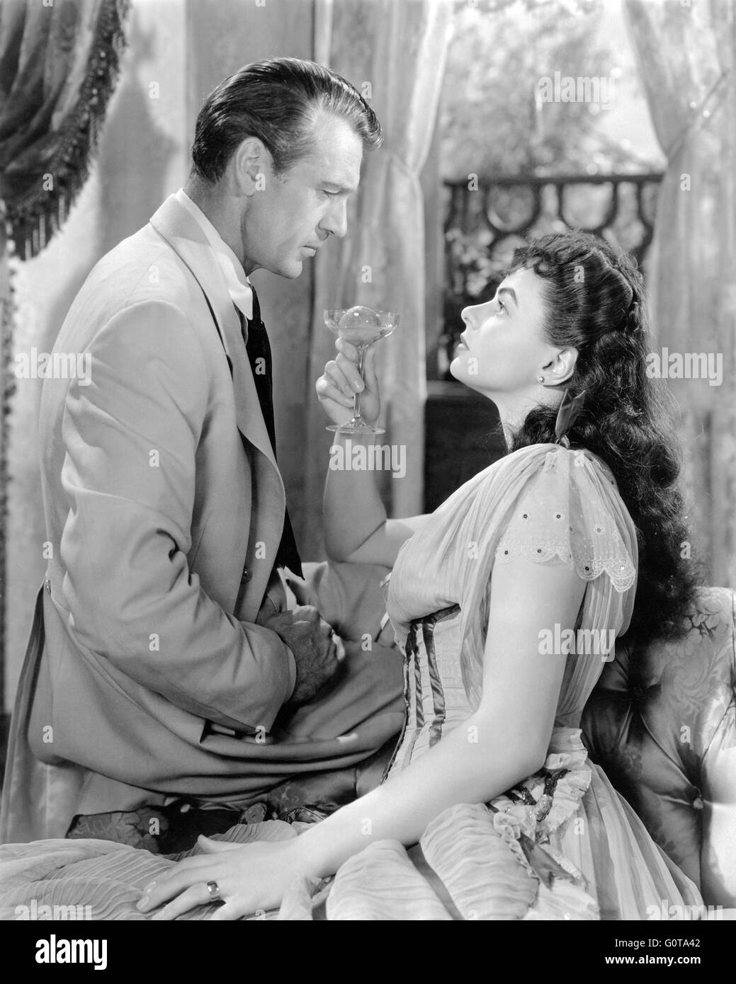Gary Cooper and Ingrid Bergman / Saratoga Trunk / 1945 directed by Sam Wood (Warner Bros. Pictures) Stock Photo