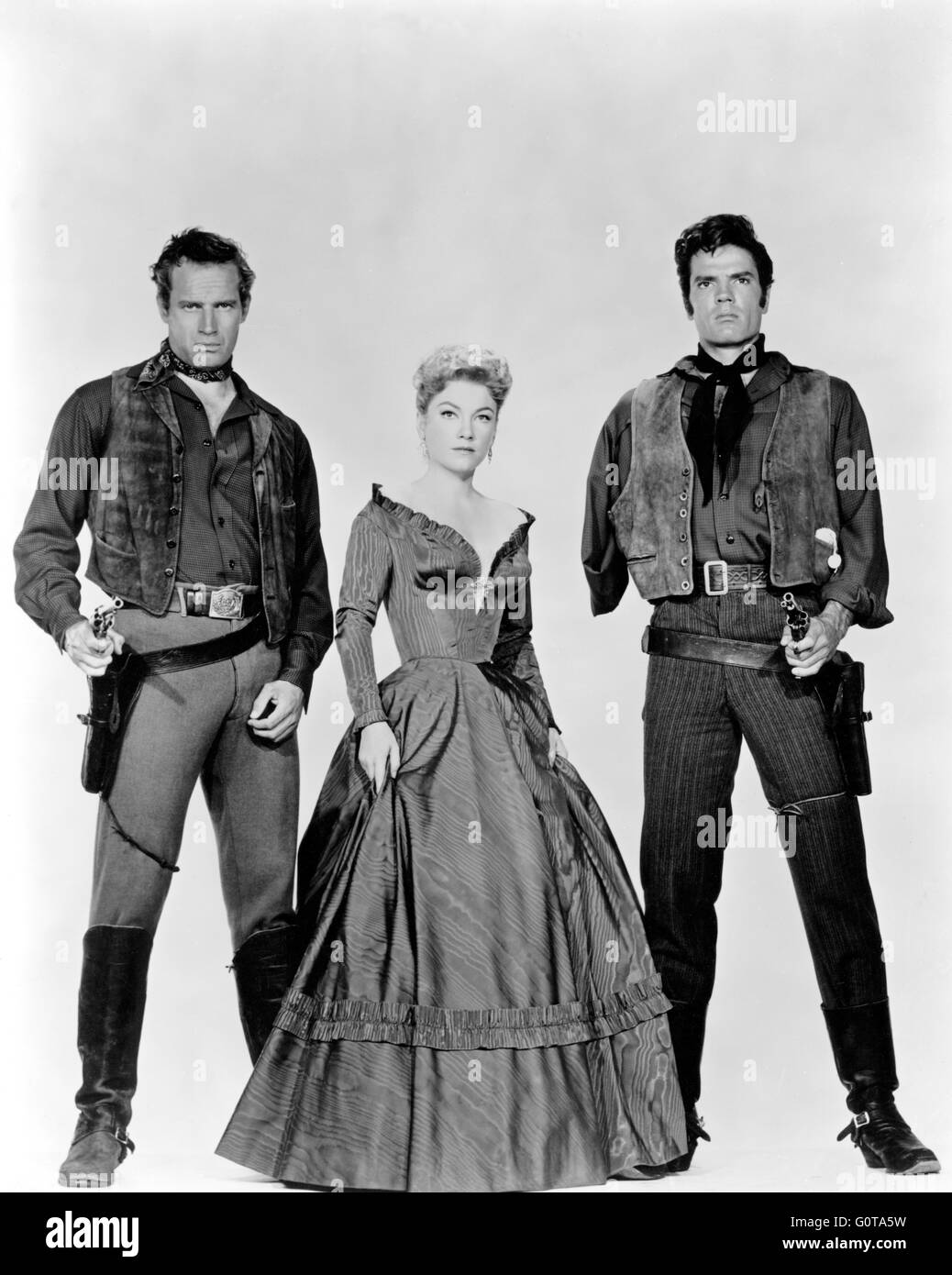 Charlton Heston, Anne Baxter and Tom Tryon / Three Violent People / 1956 directed by  Rudolp Maté (Paramount Pictures,) Stock Photo