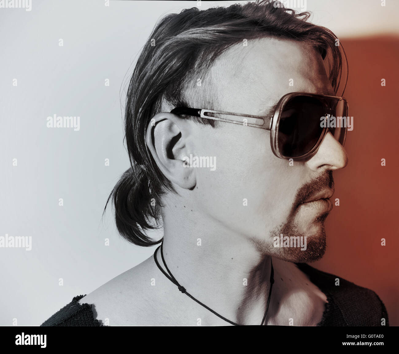 Portrait of young man wearing a stylish sunglasses Stock Photo - Alamy