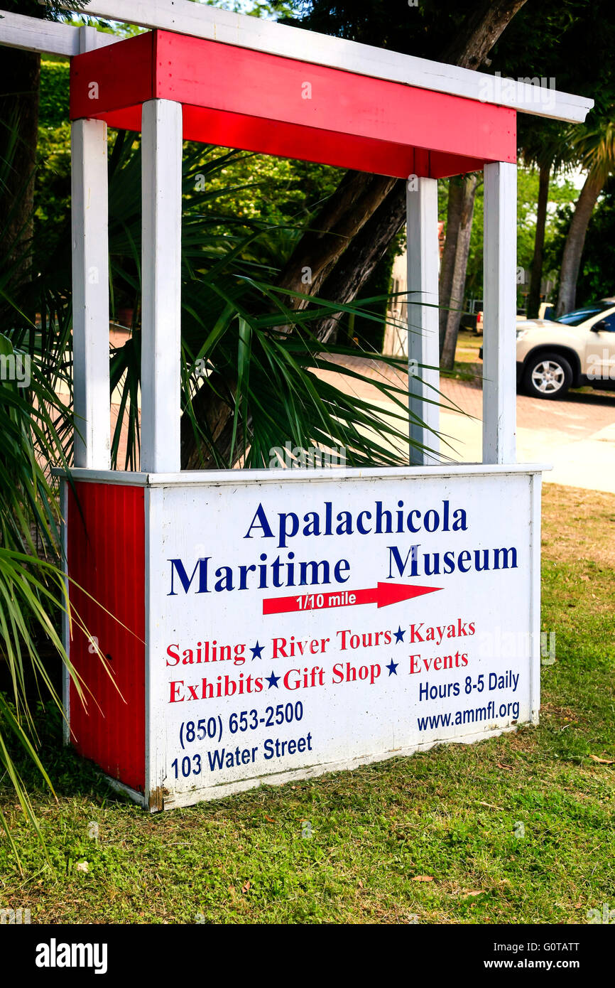 Sign pointing to the Apalachicola Maritime Museum on the waterfront in Apalachicola city on the Florida panhandle. Stock Photo