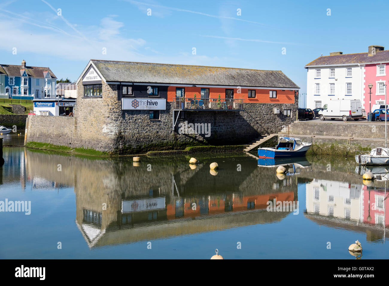 The Hive cafe and restaurant from across the inner harbour.  Aberaeron, Ceredigion, Mid Wales, UK, Britain Stock Photo