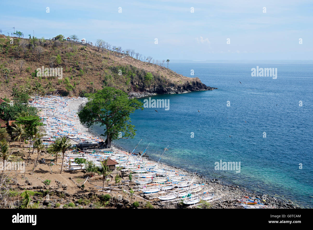 Hundreds of beached fishing boats Aas Beach Amed East coast Bali Indonesia Stock Photo