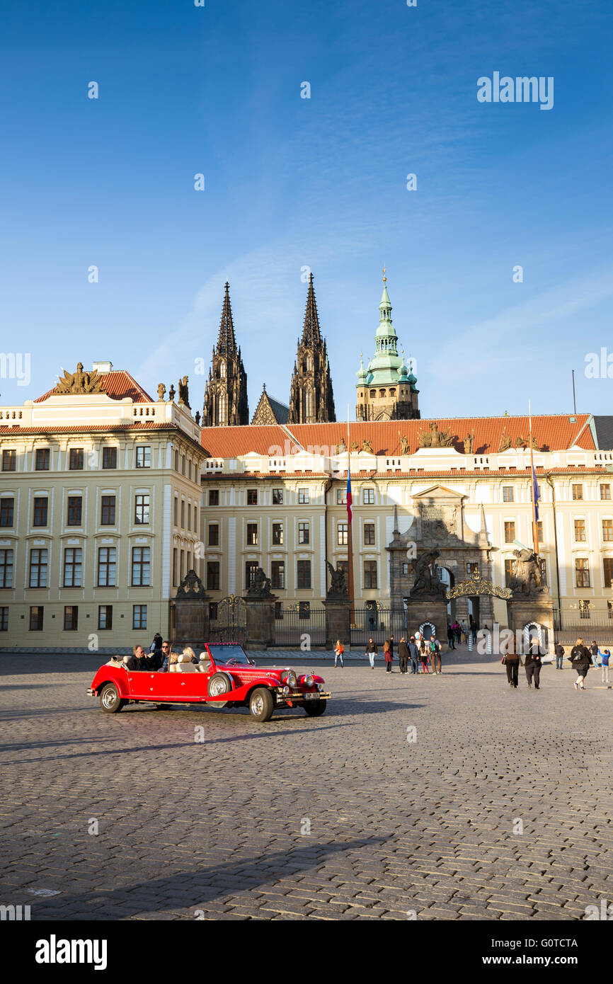 Vintage red car for tourist rides, Hradcanske namesti, Prague castle, Czech republic, Europe Stock Photo