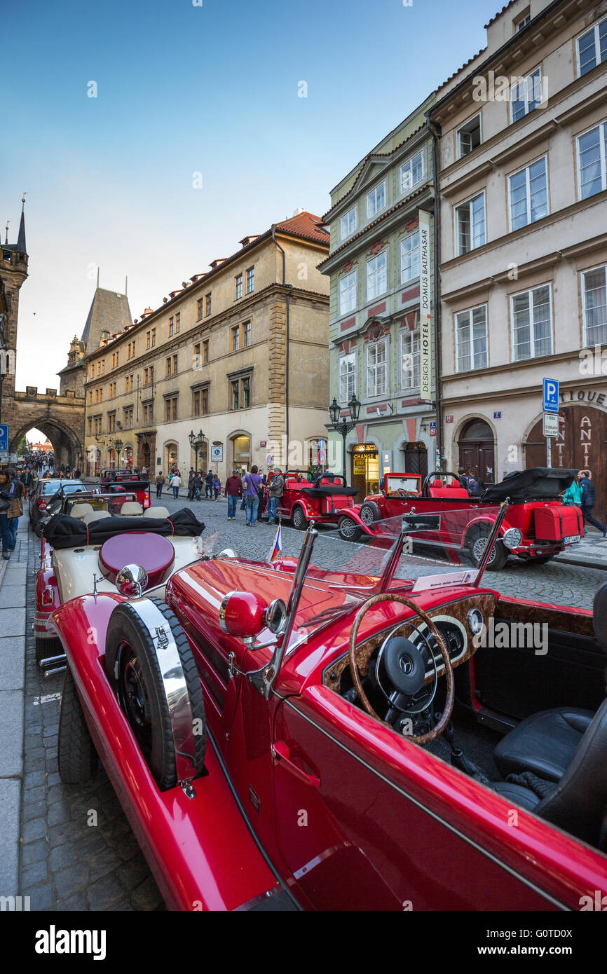 Old fashioned sightseeing tour cars, Mostecka street, Mala Strana district, Prague, Czech Republic, Europe Stock Photo