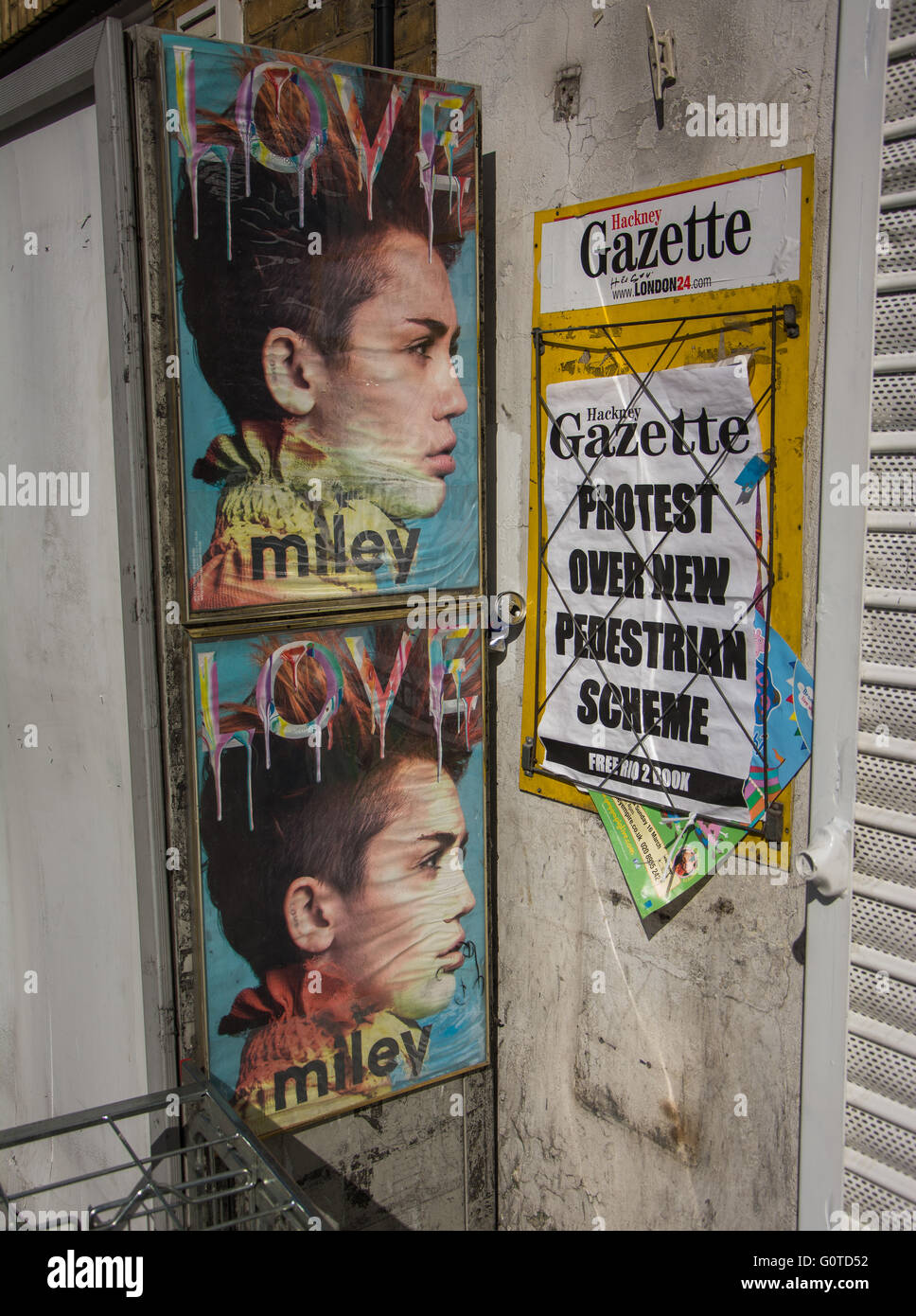 Pop culture Miley Cyrus posters in trendy East London Stock Photo