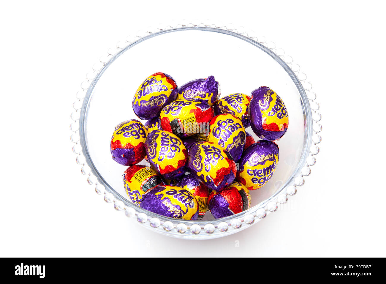 Cadbury's cream eggs, Chocolate Easter eggs isolated on a white studio background. Stock Photo
