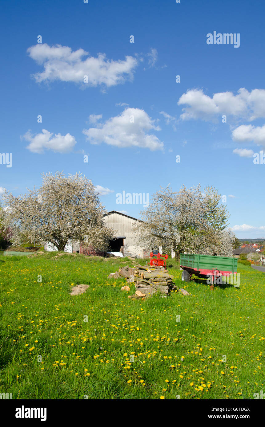 Barn with a trailer infront Stock Photo
