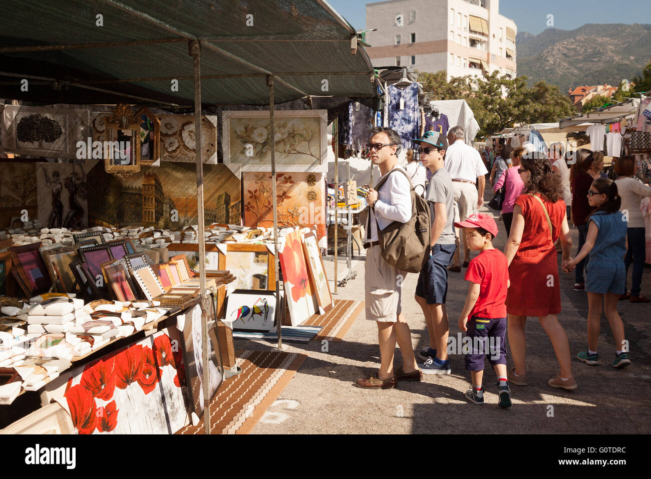 A family with children shopping at a market stall, Marbella market, Andalusia Spain, Europe Stock Photo