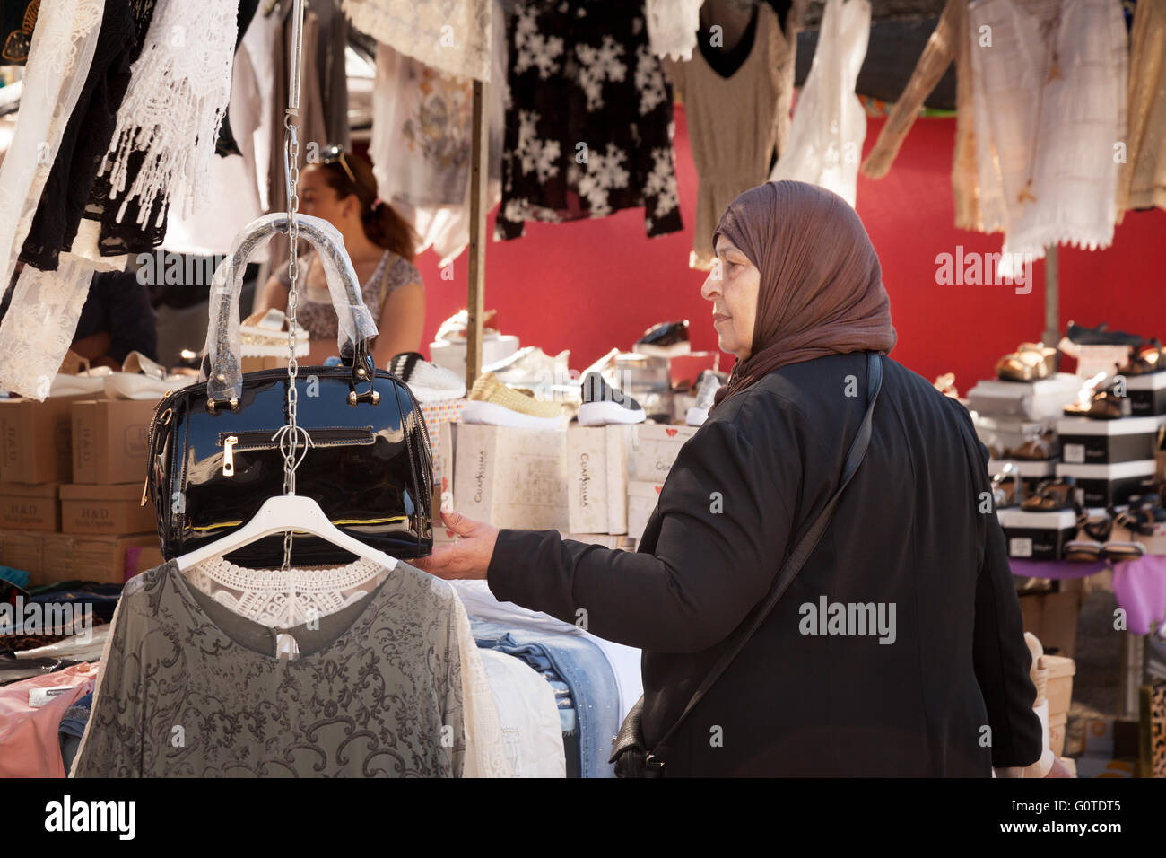 A muslim woman shopping for clothes, Marbella Market, Andalusia, Spain, Europe Stock Photo