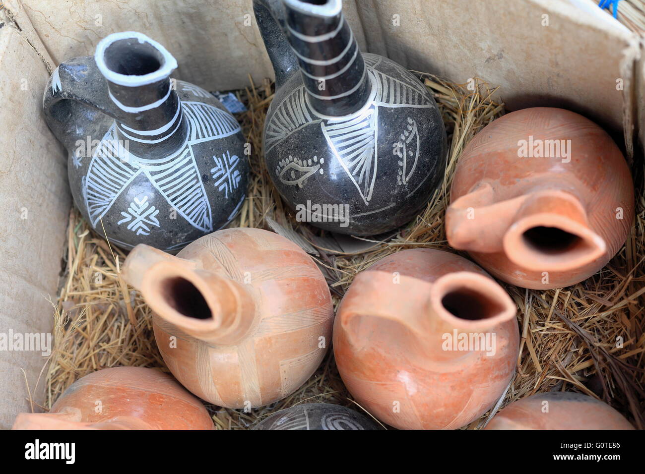 Traditional tigrayan pottery-pieces in black and white and ocher color-for sale in a carton. Shop of in Mek'ele-Mekelle-Ethiopia Stock Photo
