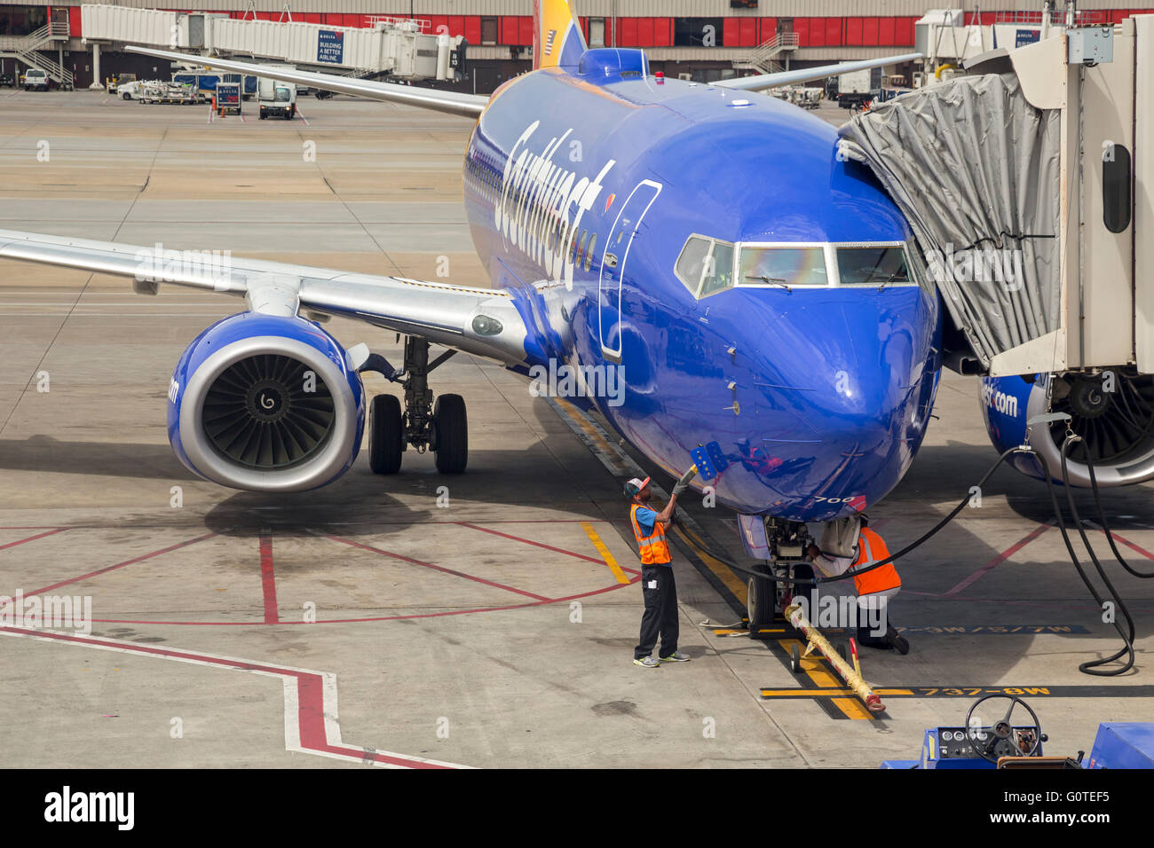 Atlanta, Georgia - Southwest Airlines workers service an arriving airliner at Hartsfield–Jackson Atlanta International Airport. Stock Photo