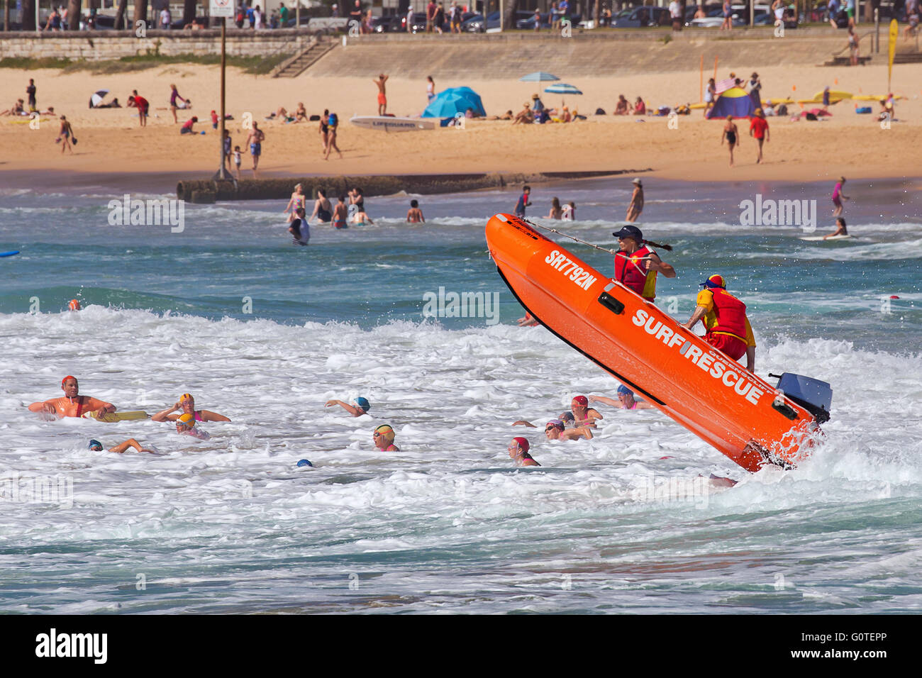 Surf lifesavers get airborne in their dinghy Stock Photo