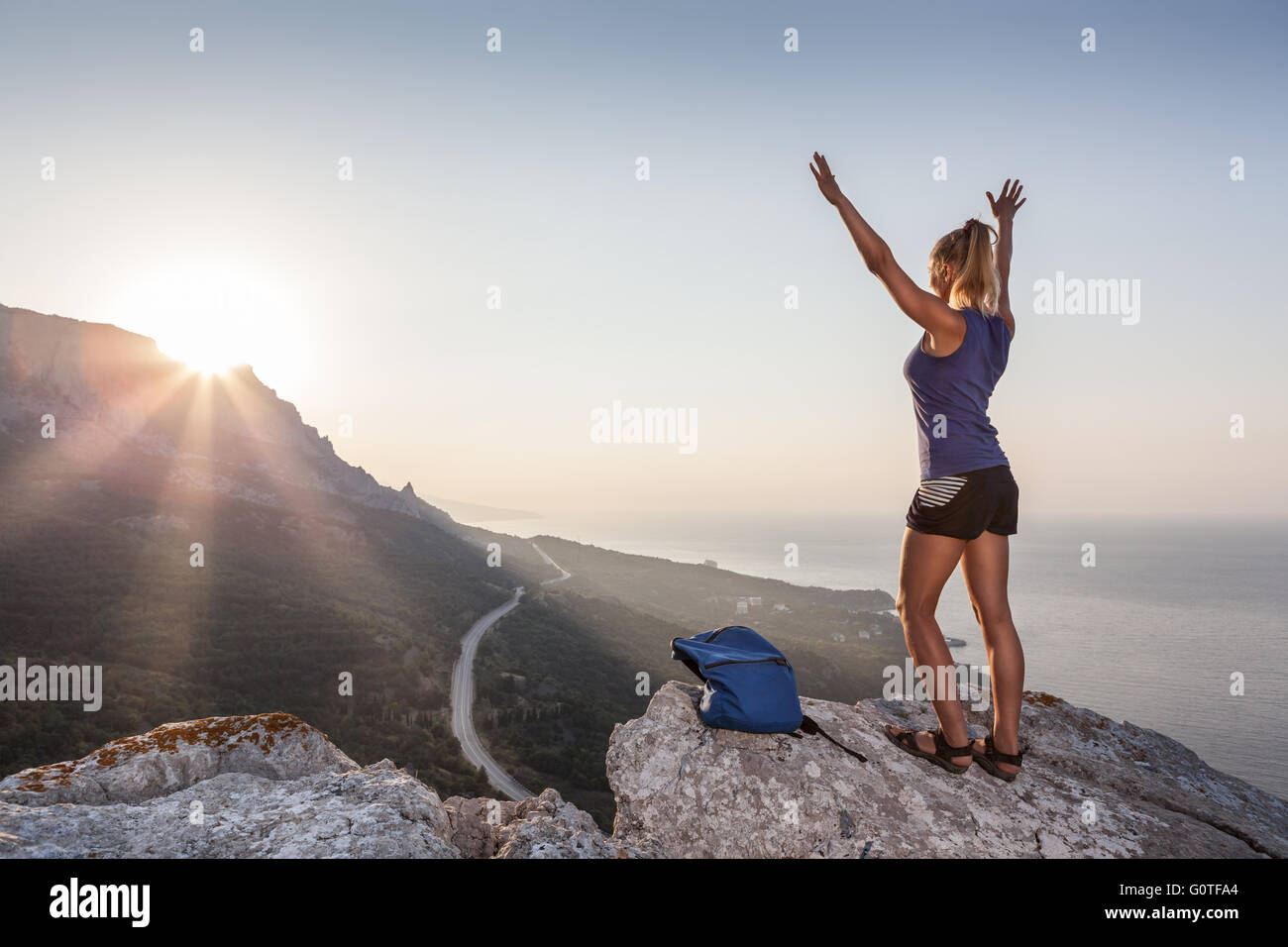 Woman on top of mountain sunset hi-res stock photography and images - Alamy