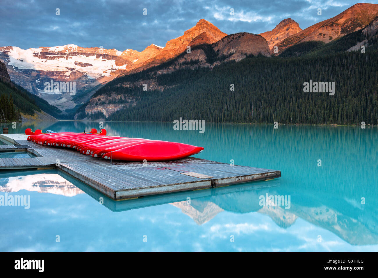 The wonderful Lake Louise, one of the most beautiful spots in the Rockies, by sunrise. Banff National Park, Alberta, Canada. Stock Photo