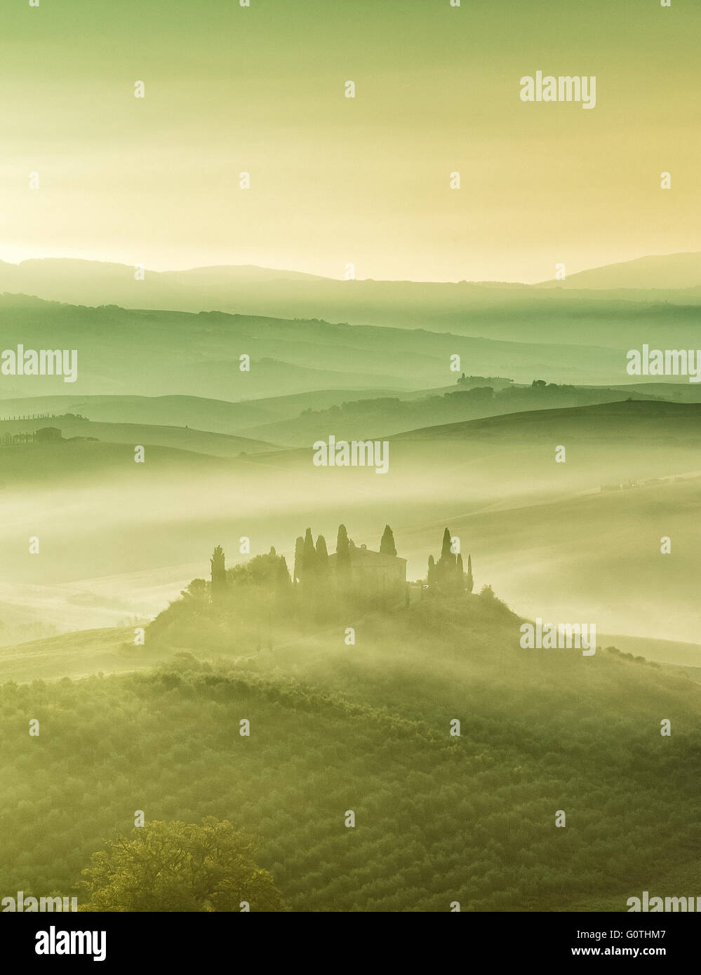 Mist at Podere Belvedere in Val d'Orcia by sunrise, Tuscany, Italy. Stock Photo