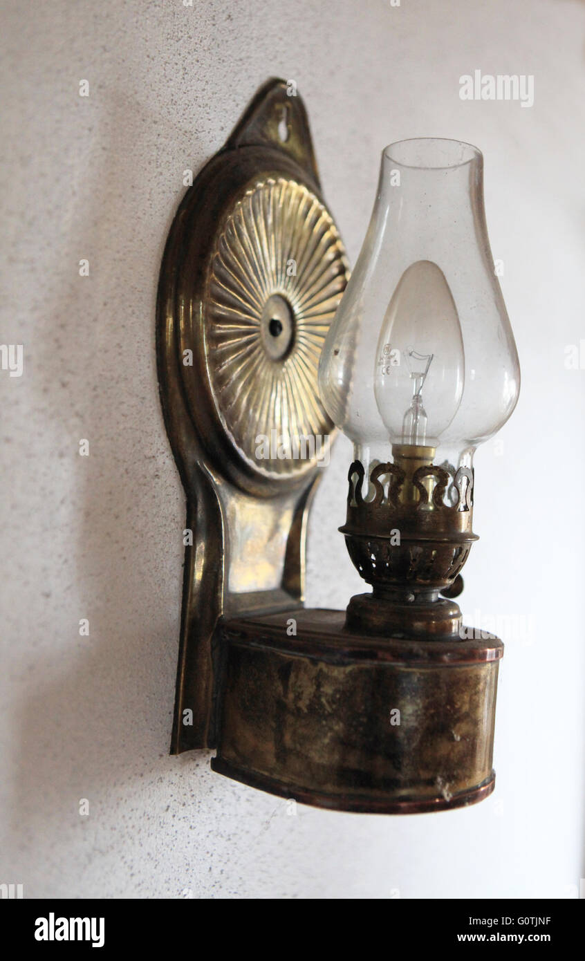Old fashioned, vintage wall lamp in Irish cottage Stock Photo