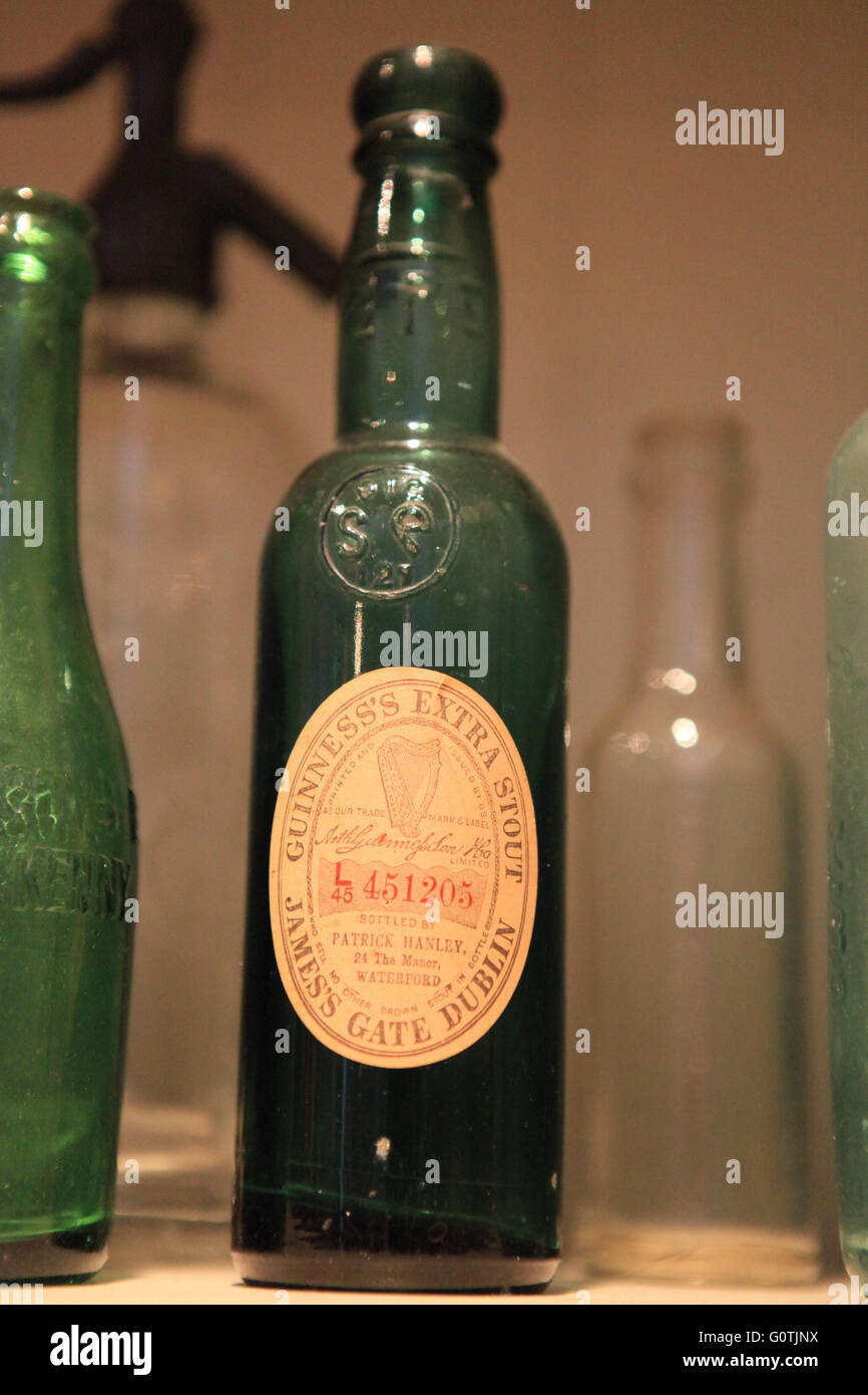 Old green vintage glass Guiness bottle Stock Photo