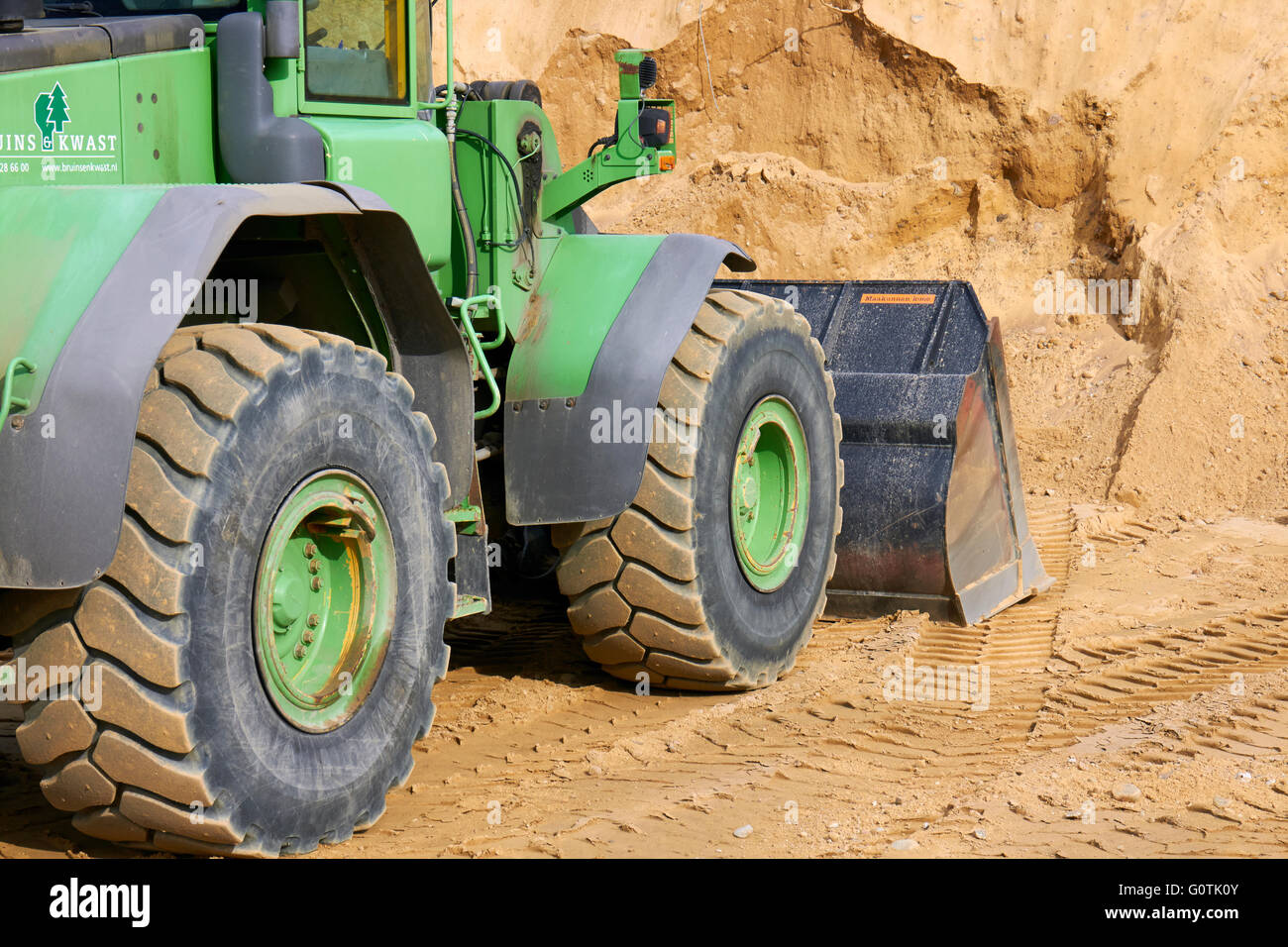 Front loader and a pile of sand, Finland Stock Photo