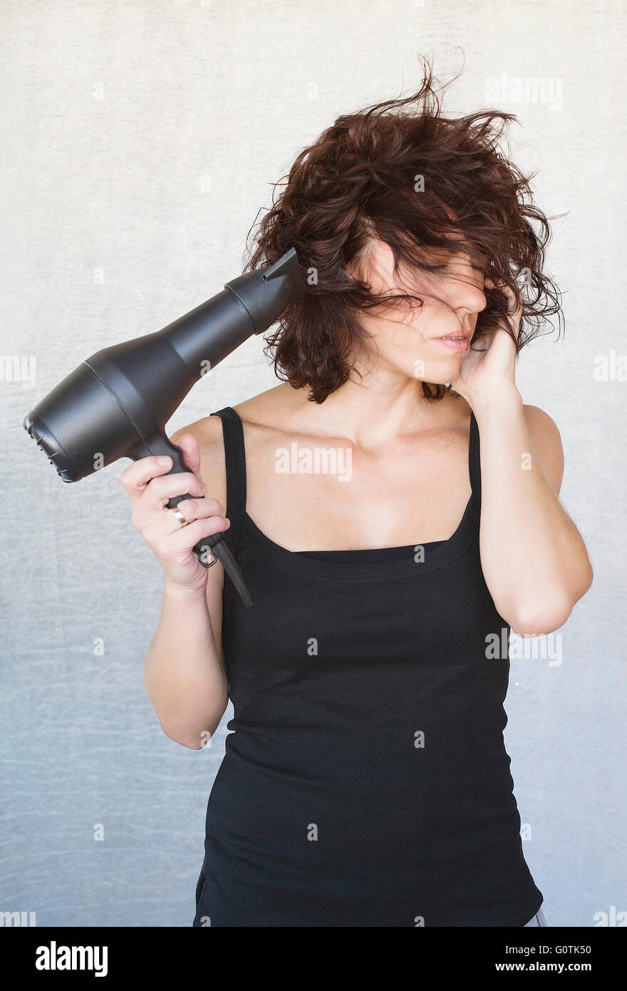 Mature woman blow drying hi-res stock photography and images - Alamy