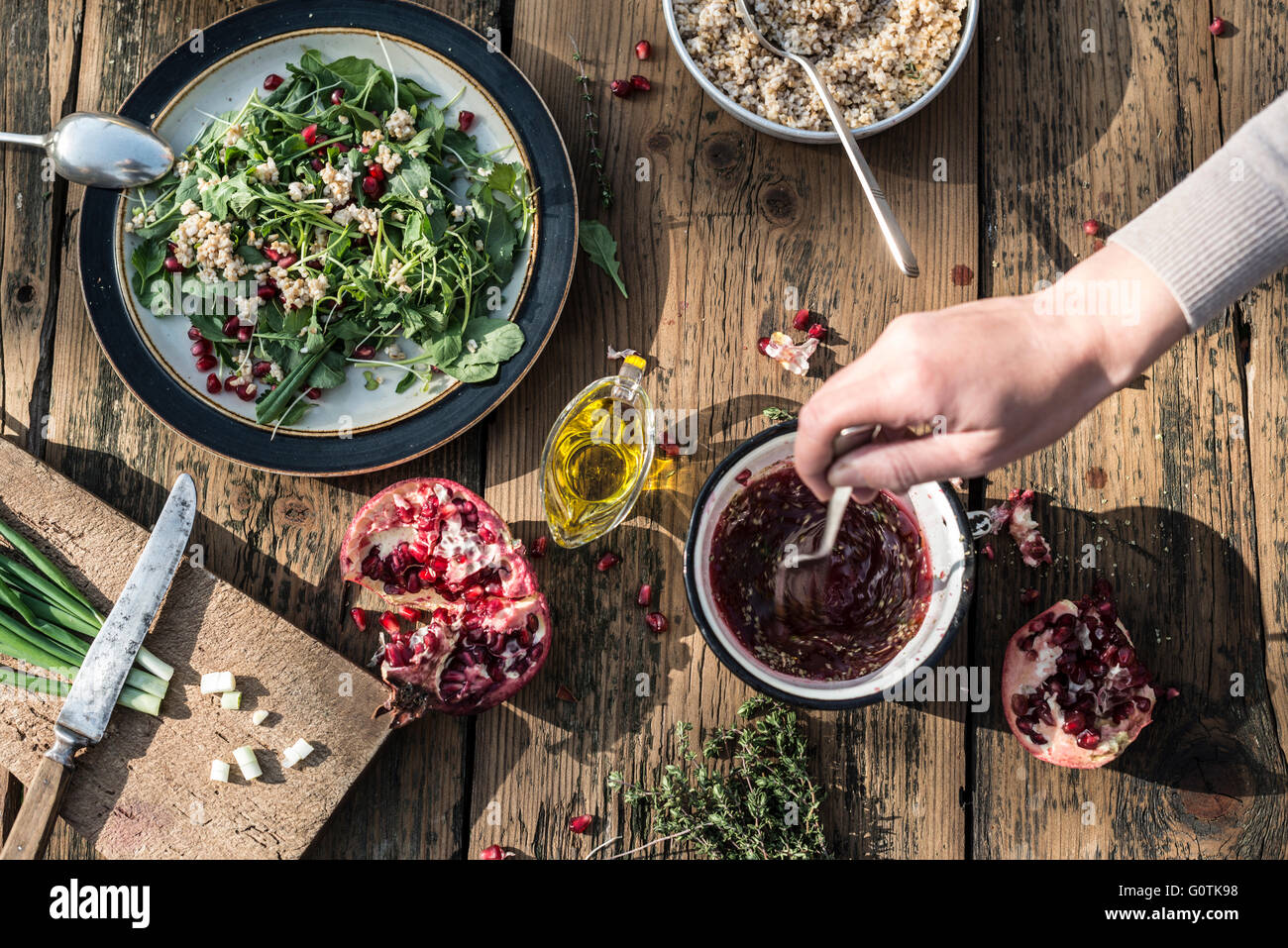 Green salad with pomegranate, manna croup and onion Stock Photo