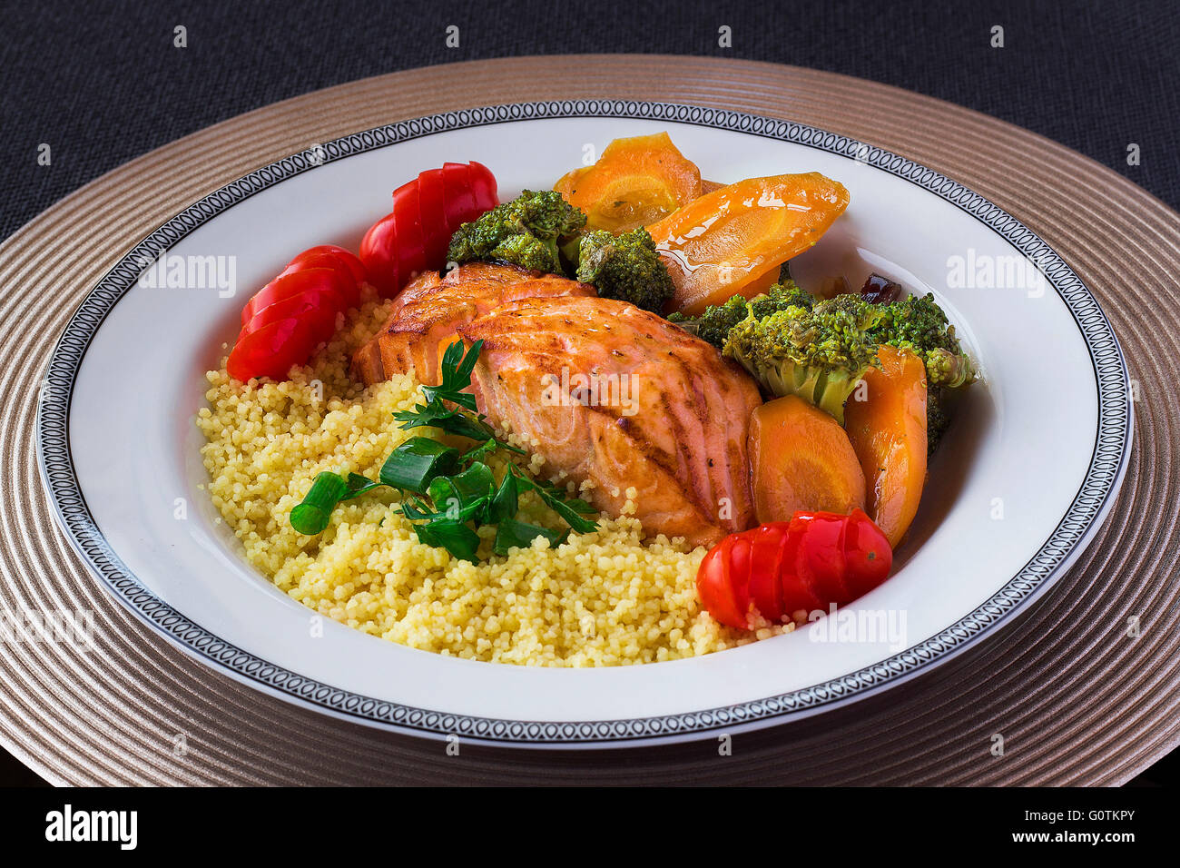 Bowl of salmon, couscous and vegetables Stock Photo Alamy