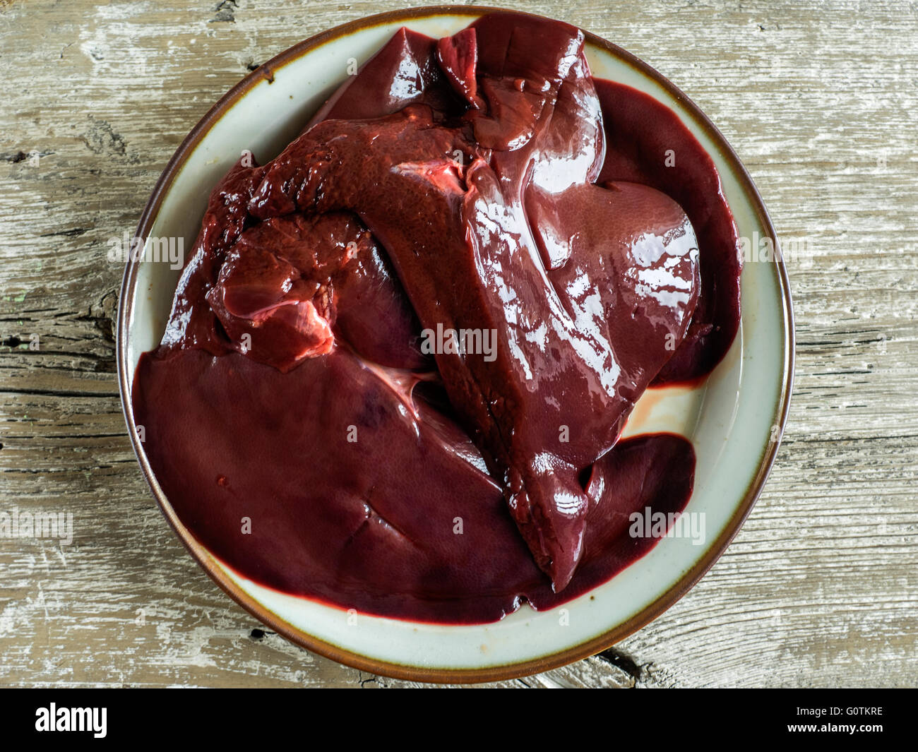 raw pork liver on a plate Stock Photo