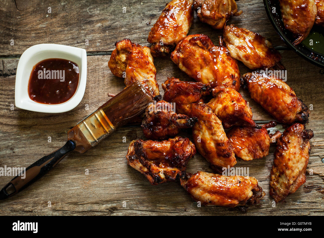 BBQ chicken wings with sauce for dip Stock Photo - Alamy