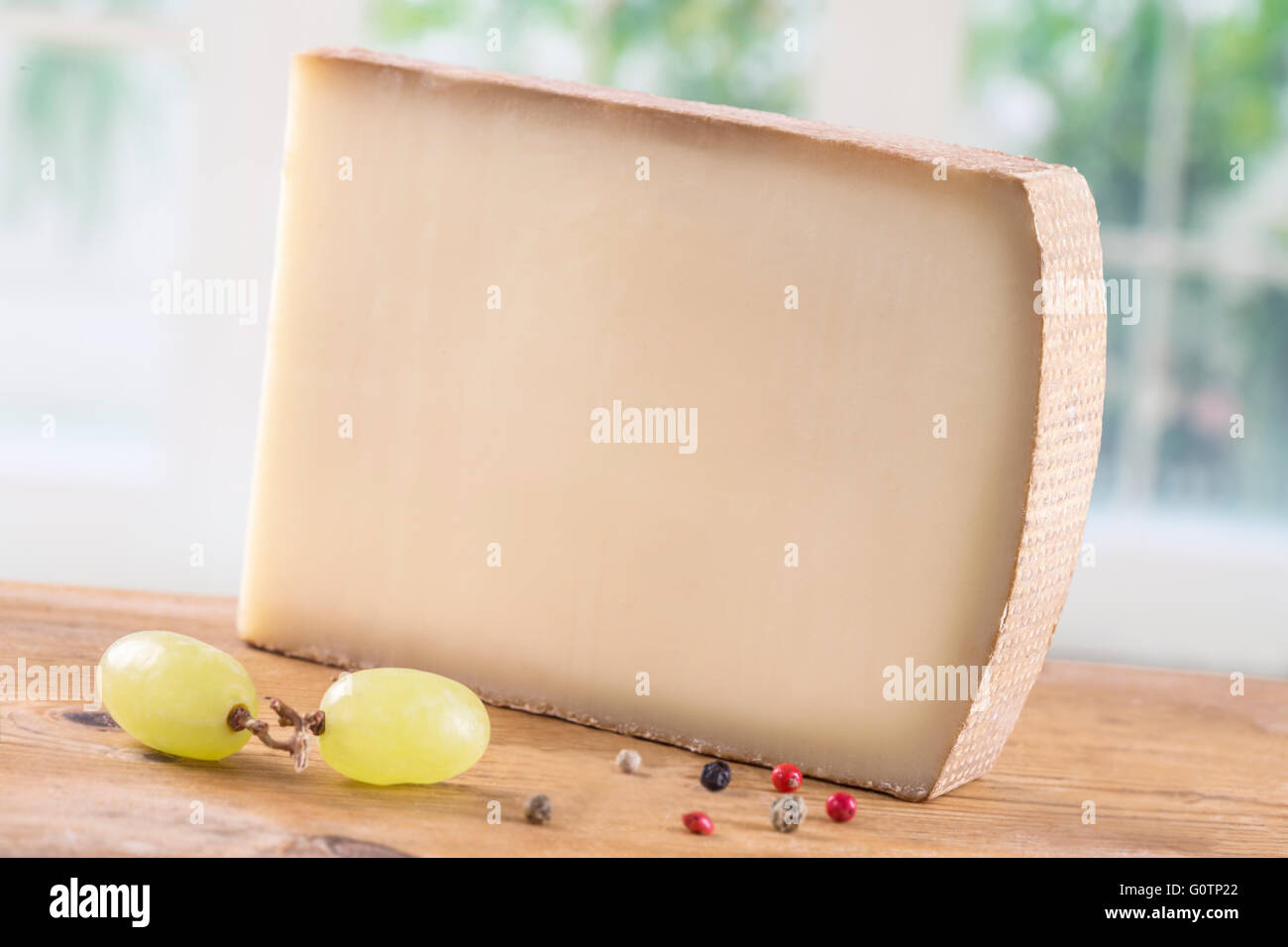 Mountain cheese from France isolated on a white background Stock Photo