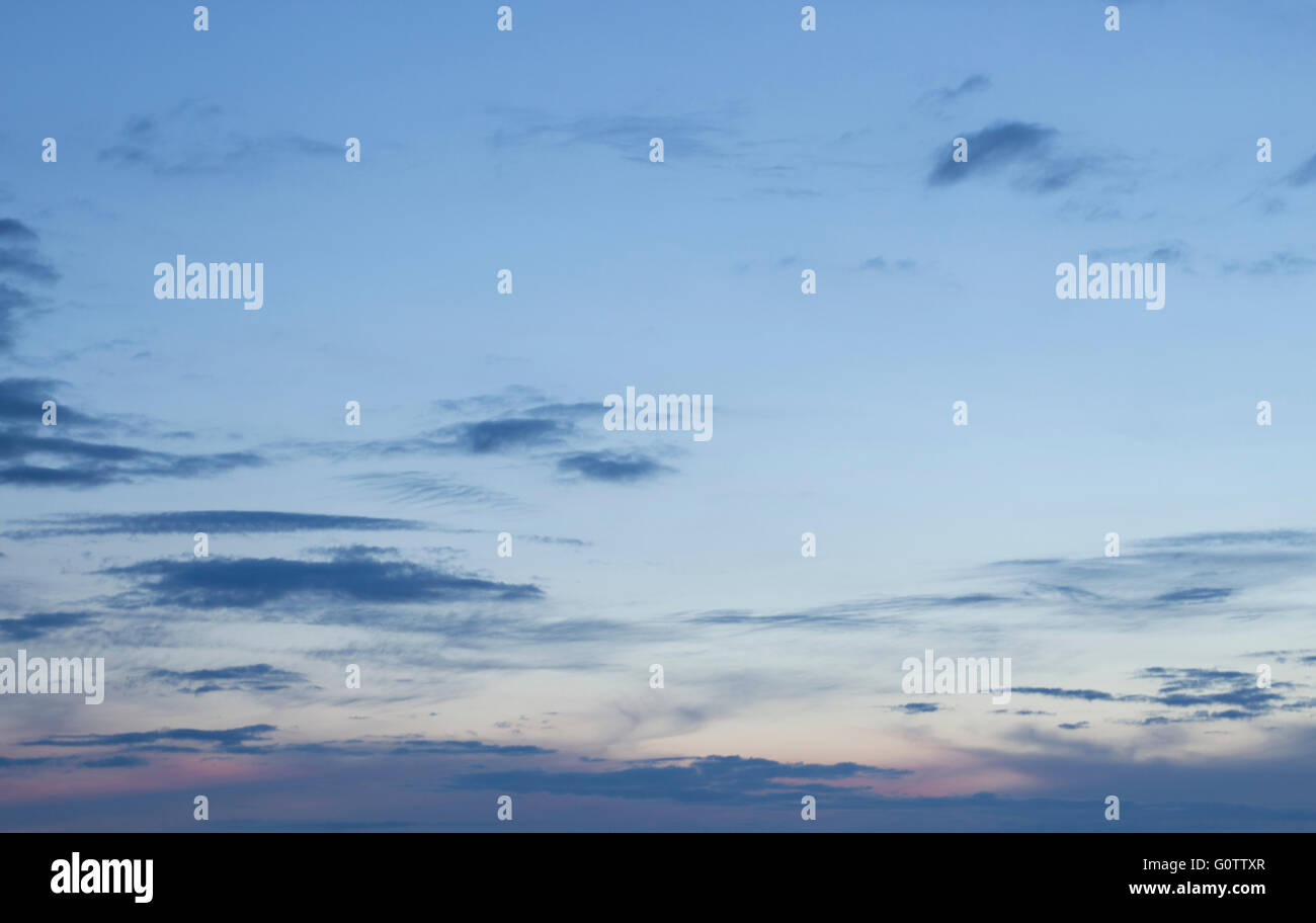 Sunset blue sky with clouds color photo Stock Photo - Alamy