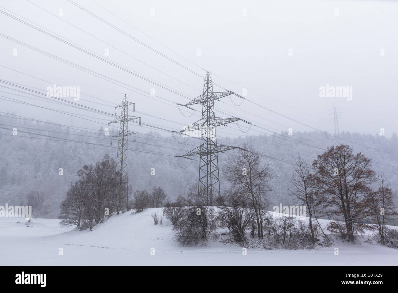 High voltage transmission line and Electricity pylon in winter on a ...