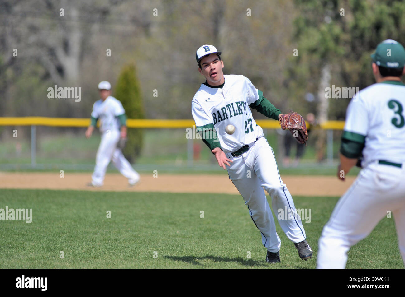 After fielding a weak ground near the mound, a pitcher underhanding