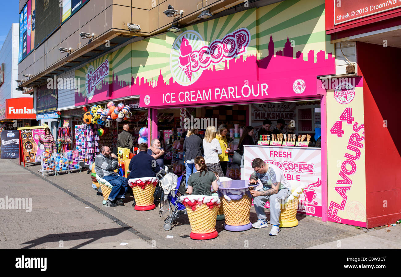 People enjoying ice cream at the Scoop ice cream parlour on the