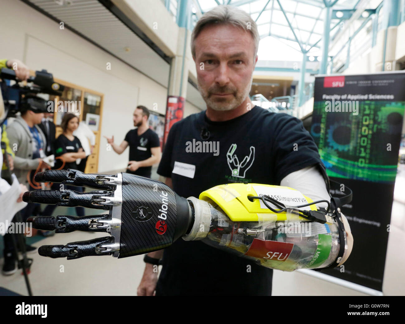 Vancouver, Canada. 3rd May, 2016. Paralympic skier Danny Letain displays his bionic hand at Simon Fraser University in Vancouver, Canada, May 3, 2016. Researchers from Simon Fraser University (SFU) developed a new robotic prosthesis with an armband of pressure sensors that track movements of the muscles to carry out intuitive actions. © Liang Sen/Xinhua/Alamy Live News Stock Photo