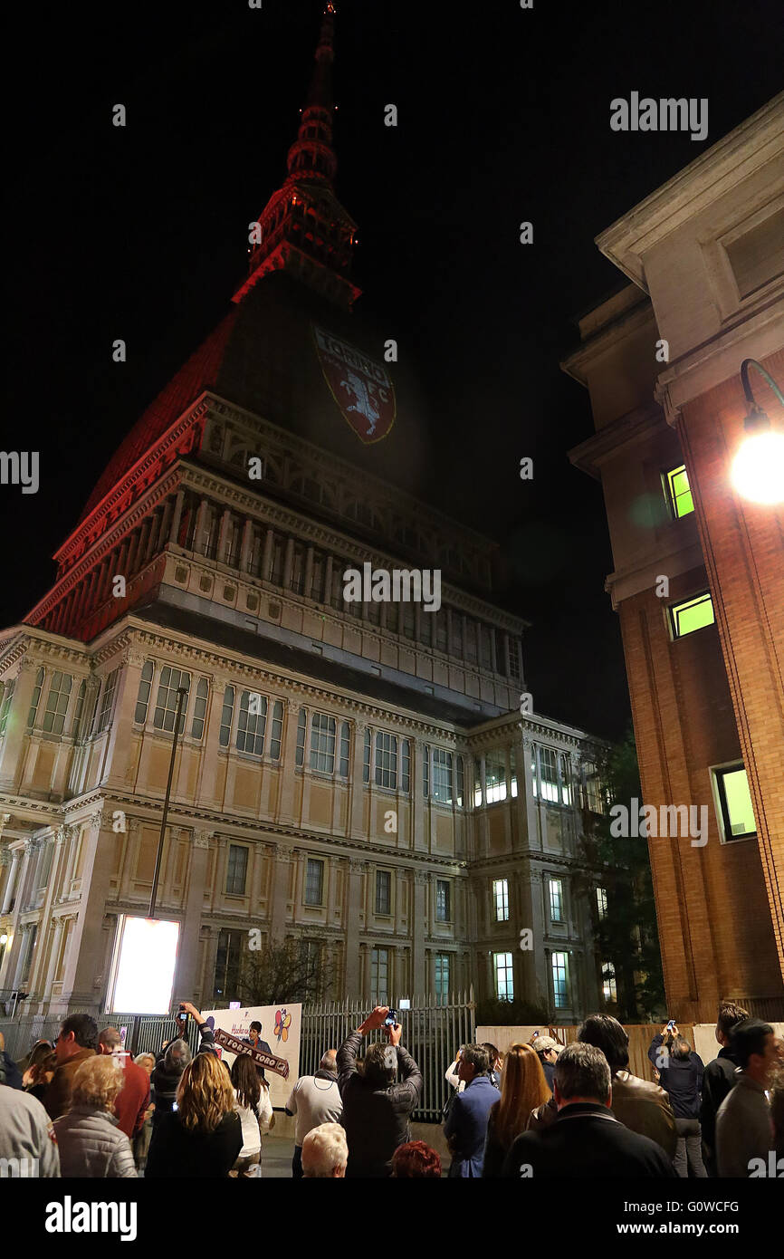 On 4 may, the 67 anniversary of the Superga air disaster, where players of the "Grande Torino" lost their lives in a plane crash, the symbol of Turin, the Mole Antonelliana is lighted with red-Garnet and the main façade is projected the team's symbol (Photo by: Daniela Parra Saiani/Pacific Press) Stock Photo