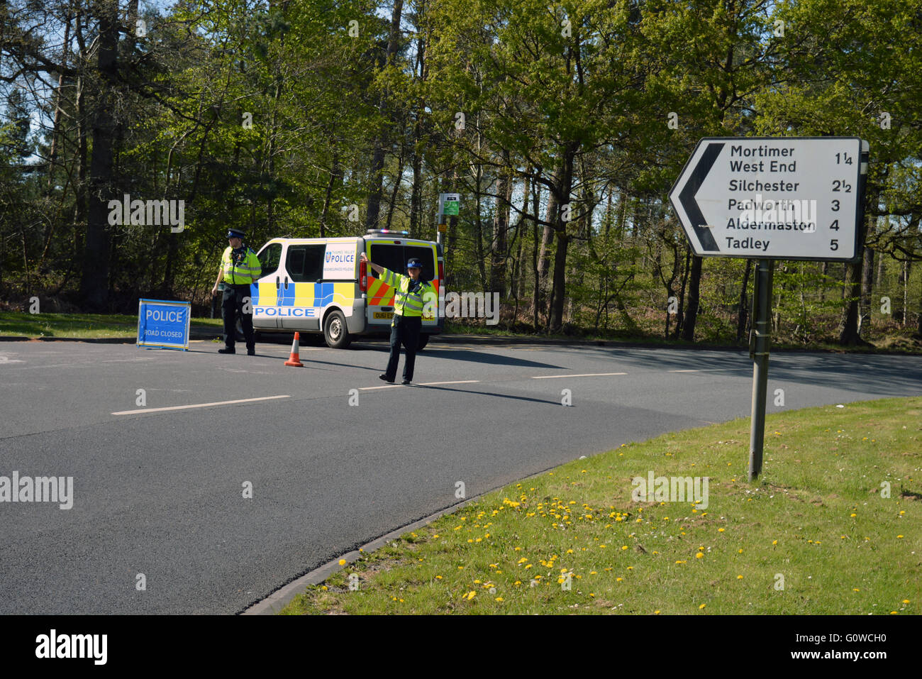 Police block burghfield road off leading to Englefield, Estate, due to thirty acre forest fire. Stock Photo