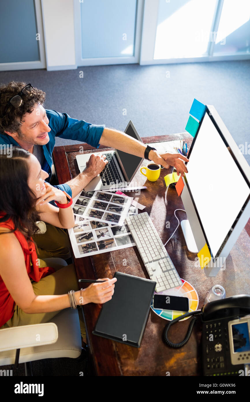 Colleagues using a graphic pad Stock Photo - Alamy
